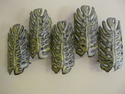 Metal wall art with functional tea light holders