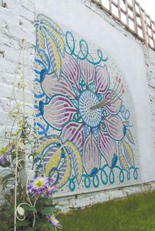 Mosaic-on-garden-wall family garden design